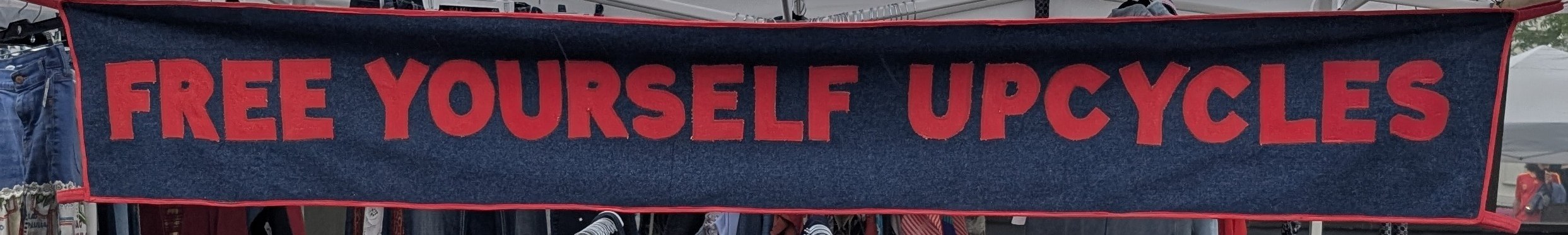 Free Yourself Upcycles hand-embroidered market banner