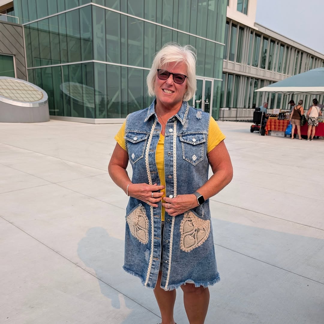 The maker behind Free Yourself Upcycles wearing one of her upcycled denim pieces